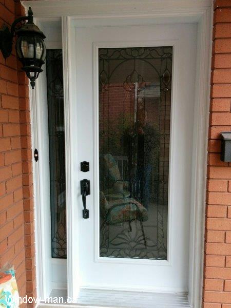 Exterior Front Door installation. Entry insulated White. Single full glass full glass sidelight. Manchester Classic stained glass collection. Beveled Glass patina caming